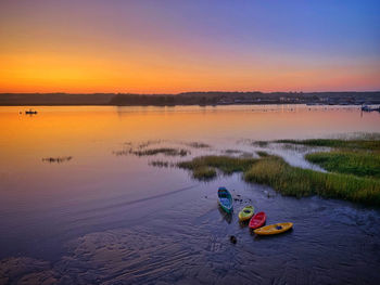 Scenic view of lake against sky during sunset