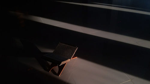 High angle view of umbrella on floor in darkroom