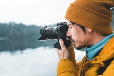 Man photographing through camera