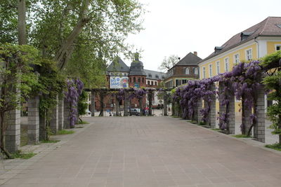 Street amidst buildings against sky