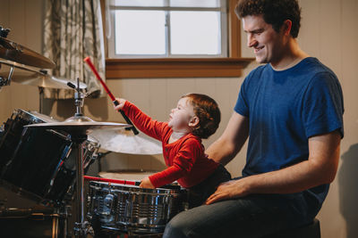 Father and son playing in store