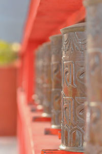 Close-up of red carving on wall