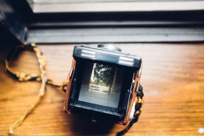 Close-up of camera on table