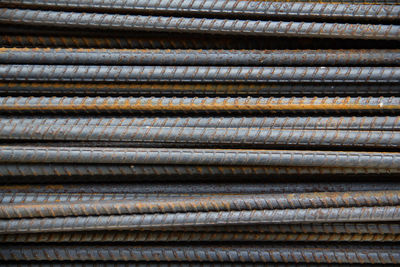 Full frame shot of stacked metal rods at construction site