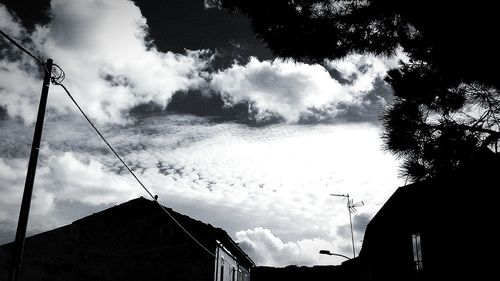 Low angle view of silhouette person against sky