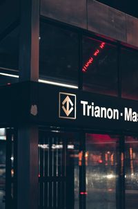Information sign in illuminated city at night