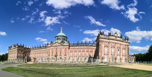 Facade of historic building against blue sky