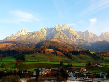 Scenic view of lake and mountains against sky