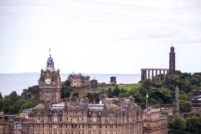 Buildings in city against sky