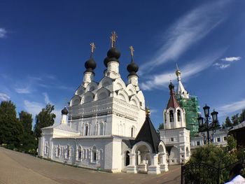 Low angle view of building against blue sky