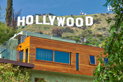 Text on building against clear sky