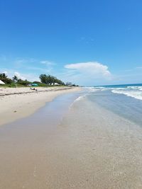 View of beach against blue sky