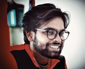 Close-up portrait of smiling young man