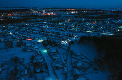 High angle view of illuminated cityscape at night