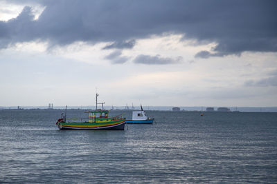 Sailboat on sea against sky