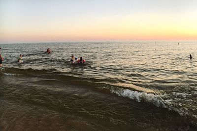 Scenic view of sea against clear sky during sunset