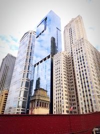 Low angle view of modern buildings against sky