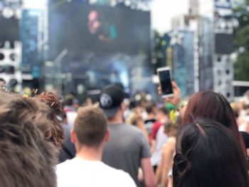 Rear view of people photographing