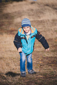 Boy standing on field