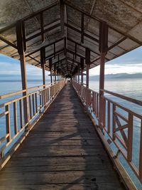 Pier over sea against sky