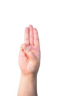 Close-up of human hand holding white background