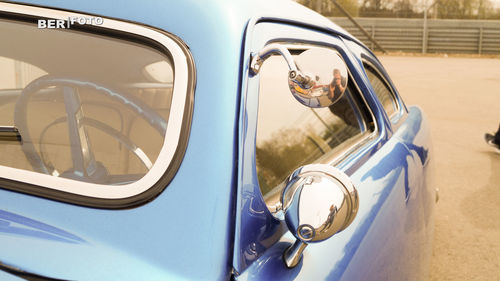 Close-up of vintage car on side-view mirror