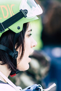 Close-up portrait of young woman wearing hat