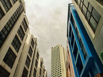 Low angle view of modern buildings against sky