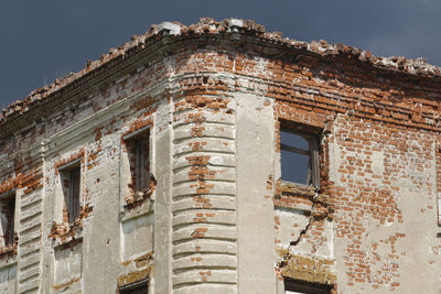 Low angle view of old building against sky