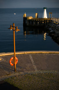 Lampost, lighthouse on the pier