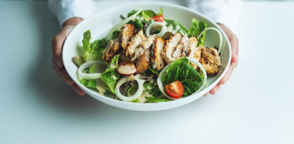 High angle view of food in bowl on white background