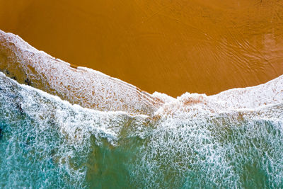 Close-up of sea waves splashing on shore