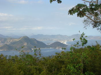 Scenic view of landscape and mountains against sky