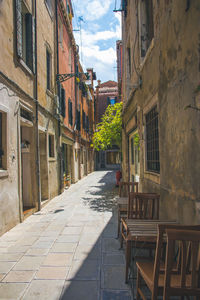 Empty alley amidst buildings in town