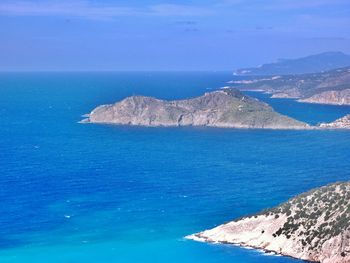 Scenic view of sea against blue sky