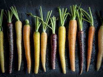 High angle view of vegetables against black background