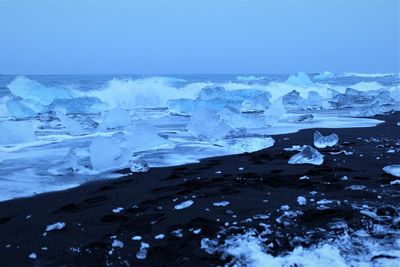 Scenic view of frozen sea against sky