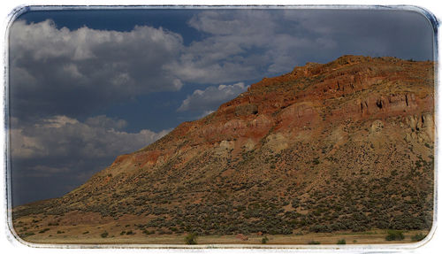 View of mountain range against cloudy sky