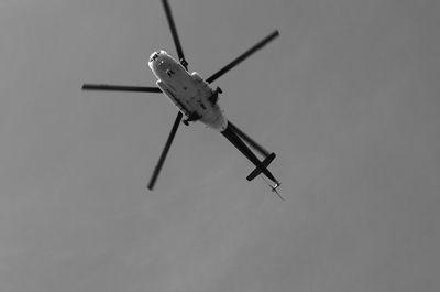 Low angle view of airplane flying against sky