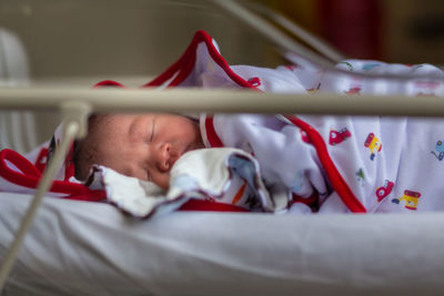 Baby sleeping on bed