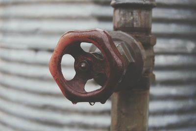 Close-up of raindrop on water valve