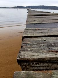 Close-up of wooden pier over lake