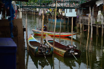 Fishing boats moored at harbor