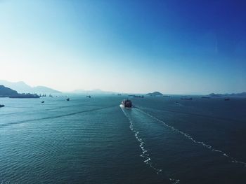 Scenic view of sea against clear blue sky