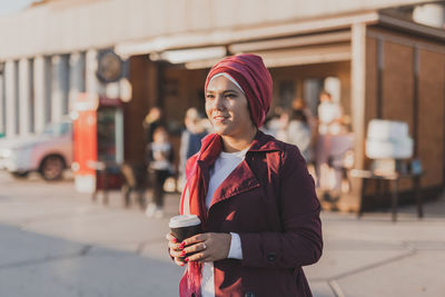 Young woman standing in city