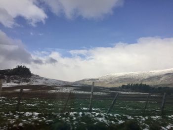 Scenic view of snowcapped mountains against sky