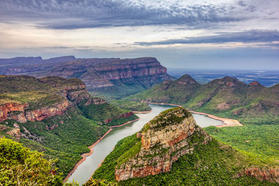 High angle view of mountain range against cloudy sky