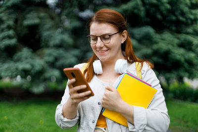 Young woman using mobile phone