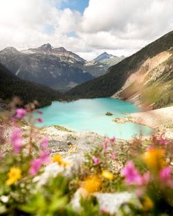 Scenic view of lake and mountains against sky