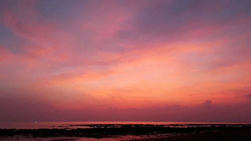 Scenic view of sea against sky at sunset